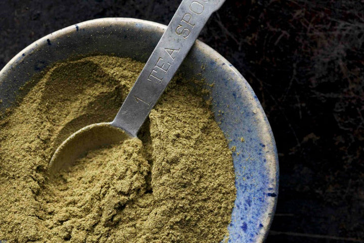 Filé powder in a bowl with a tea spoon