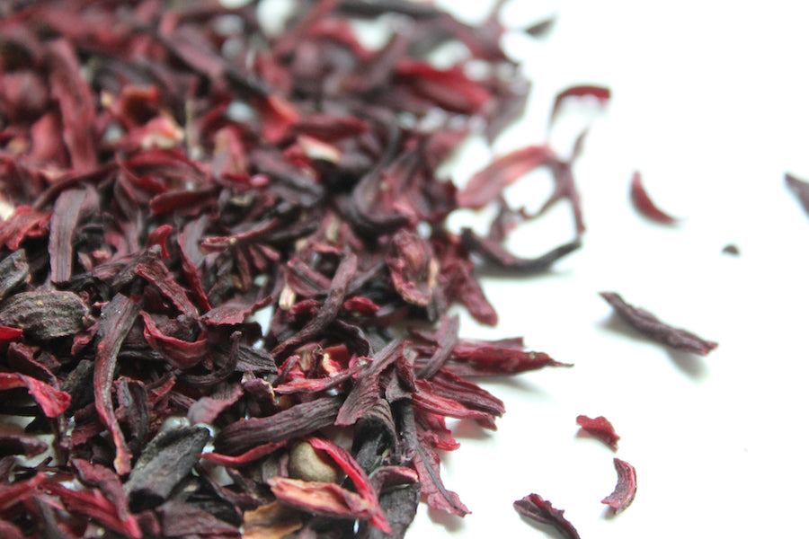 Dried hibiscus petals, cut and sifted tea pieces