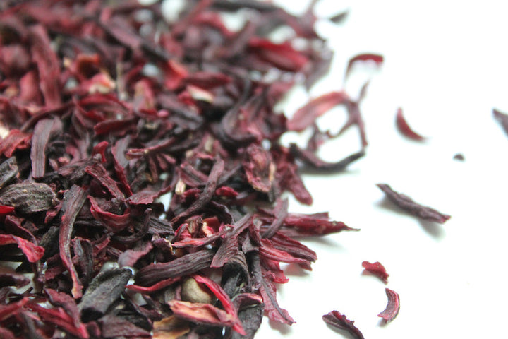 Dried hibiscus petals, cut and sifted tea pieces