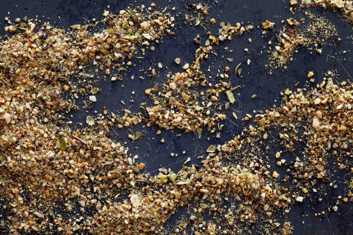 Lemon herb pepper seasoning blend with herbs and pepper flakes in a pile