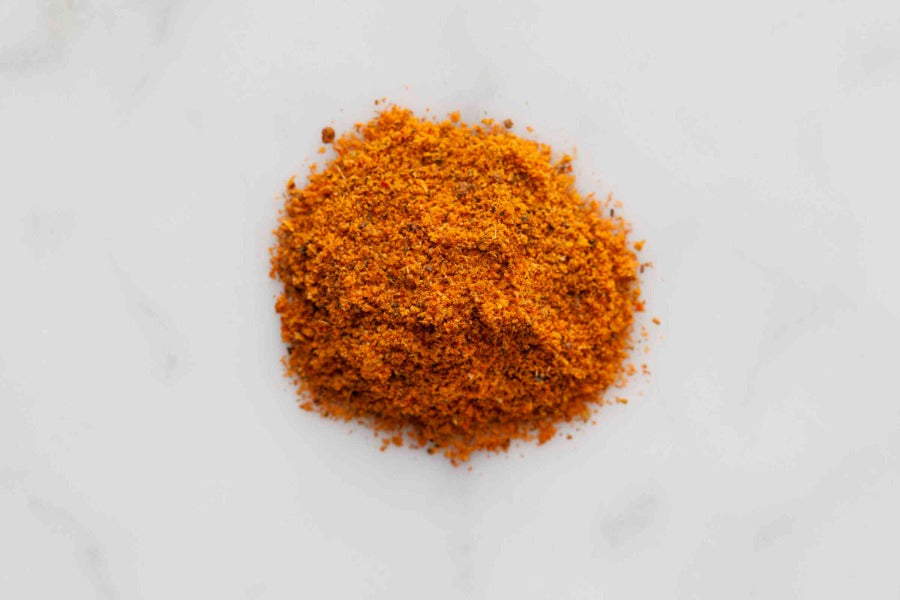 Tikka masala spice blend mound in orange-brown ground powder