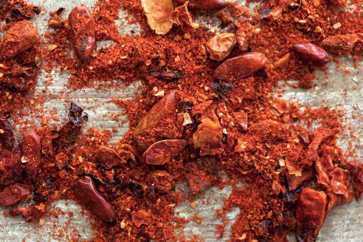 Ground red piri piri spice blend with visible chili flakes