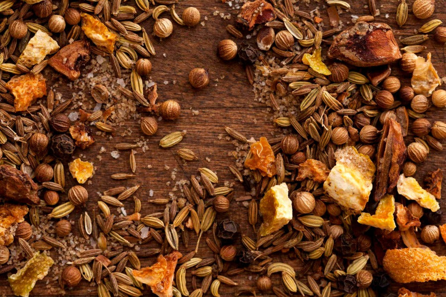 Salmon rub seasoning blend spices and flakes spread on a wooden surface