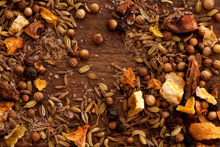 Salmon rub seasoning blend spices and flakes spread on a wooden surface