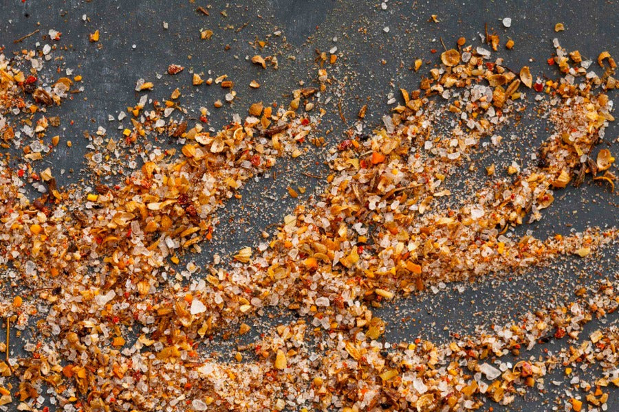 Svaneti seasoned salt crystals and spices on a dark surface