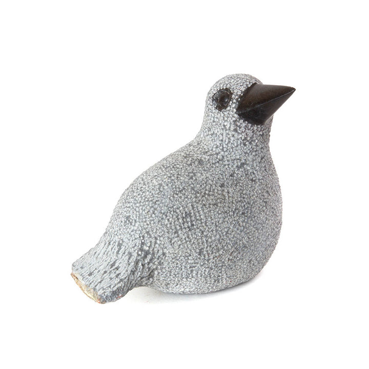 Stone duck sculpture with speckled light gray texture and dark beak, side view