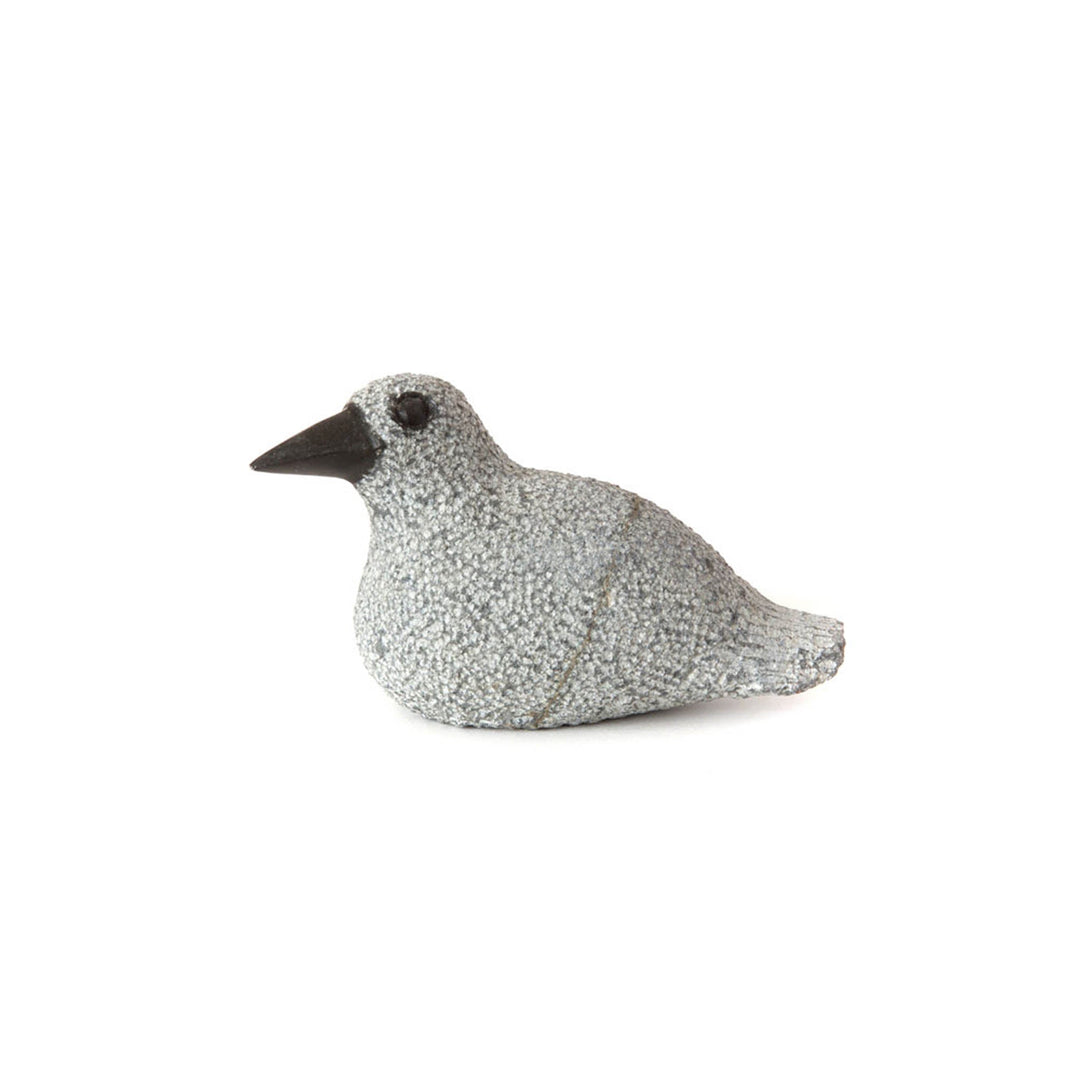 Stone duck sculpture in profile, speckled light gray finish with dark beak