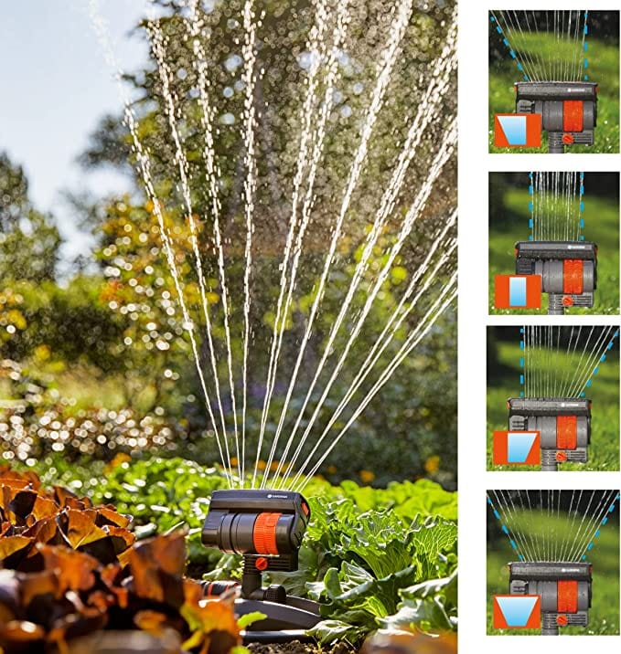Oscillating sprinkler spraying multiple water streams, mounted on ground spike