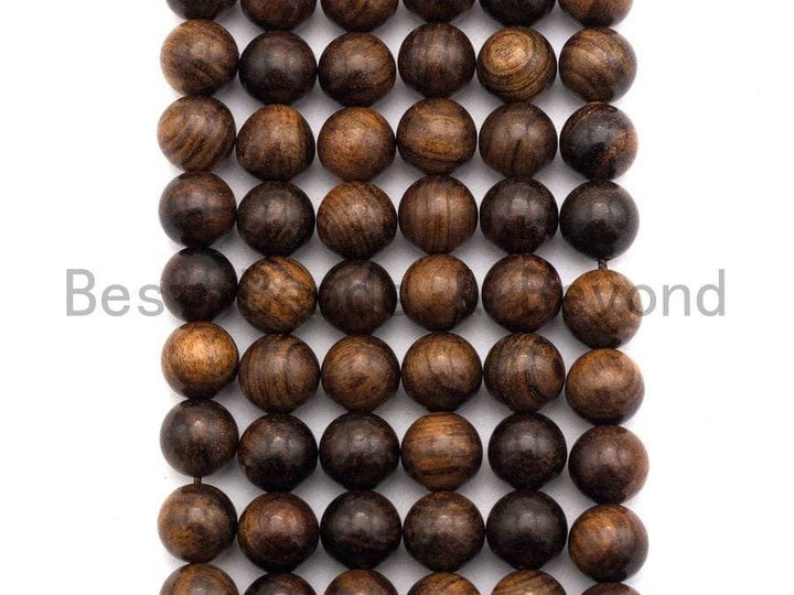 Round wood bead strand in natural brown showing varied stripes and swirls