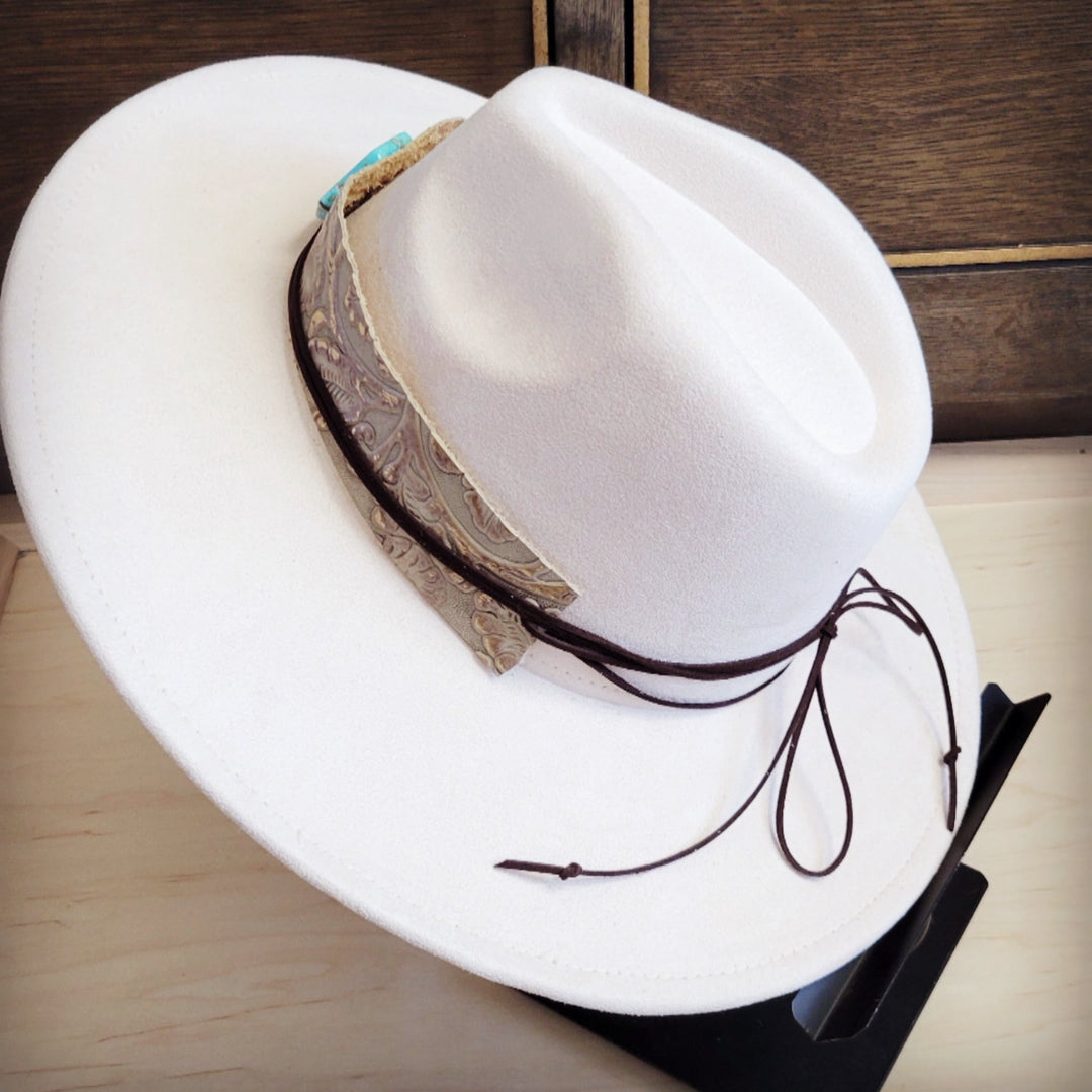 White felt cowboy hat with wide embossed leather band and turquoise top detail