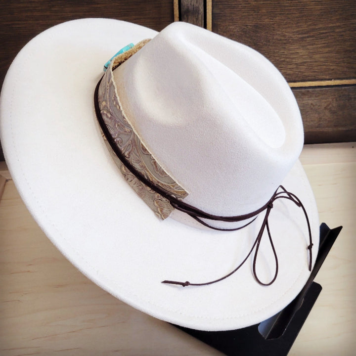 White felt cowboy hat with wide embossed leather band and turquoise top detail