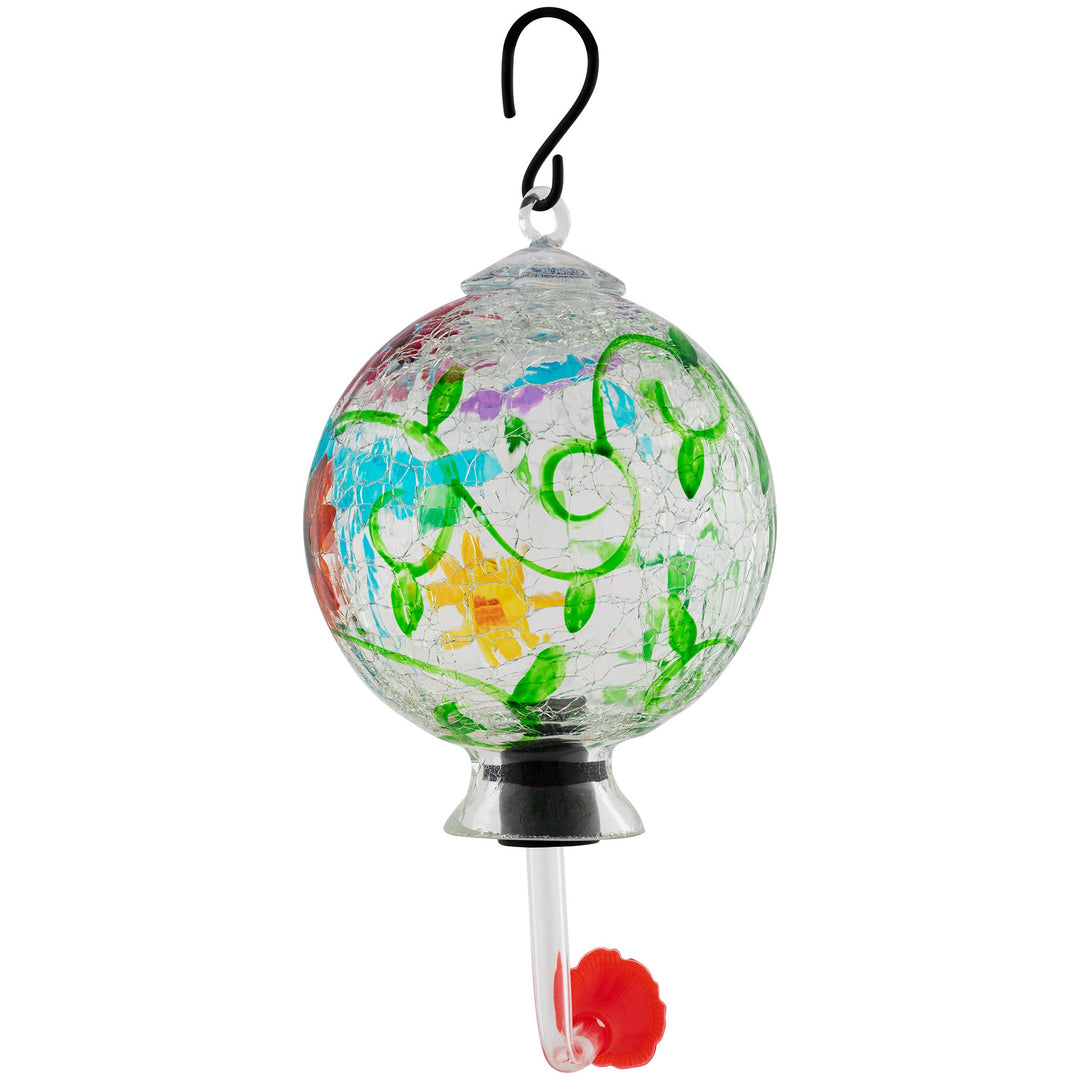 Hand-painted glass hummingbird feeder with green vines, turquoise accents, and orange dots