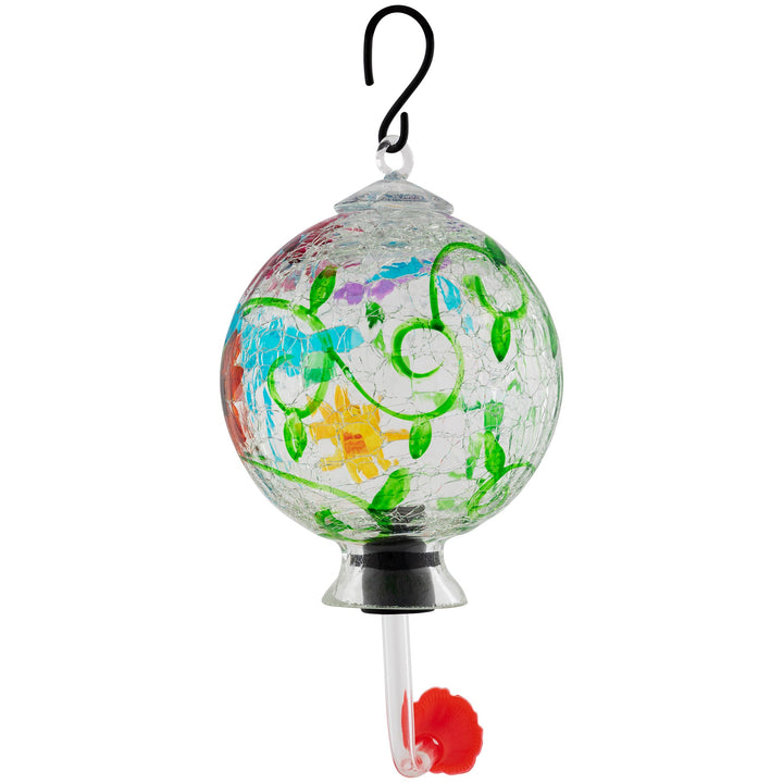 Hand-painted glass hummingbird feeder with green vines, turquoise accents, and orange dots