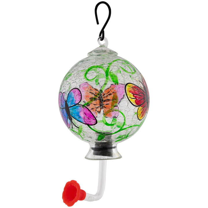 Hanging glass hummingbird feeder with green swirls and a multicolor butterfly inlay