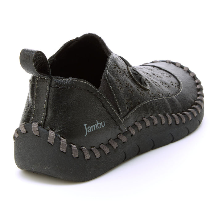 Dark black loafer from side/rear angle with moccasin stitching and metal logo tag.