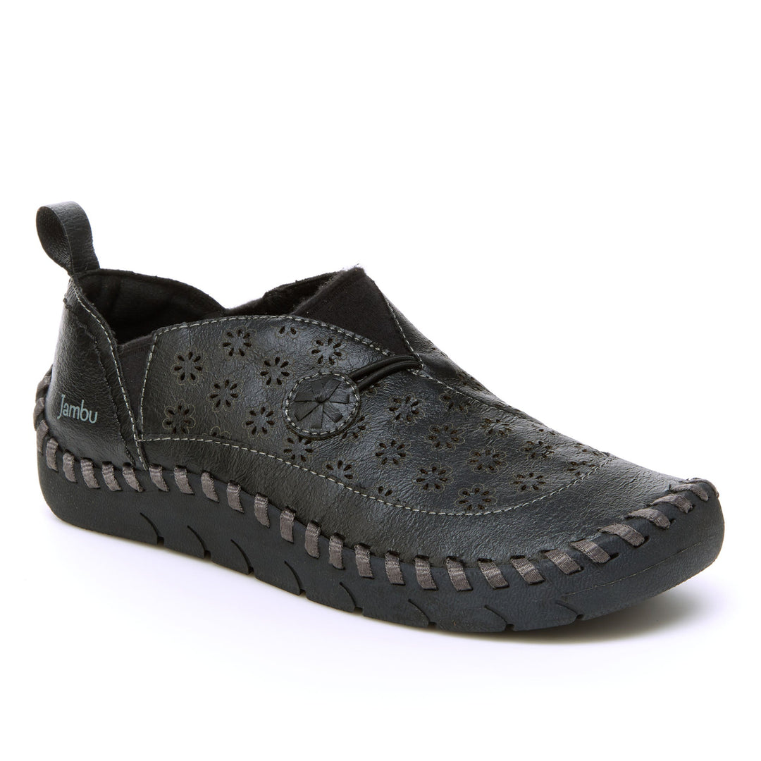 Dark black loafer with perforated floral upper and cushioned-looking sole.