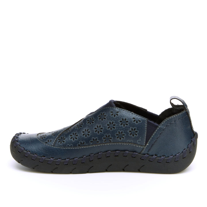 Navy vegan loafer with floral cutout upper, contrast stitching, and heel pull tab