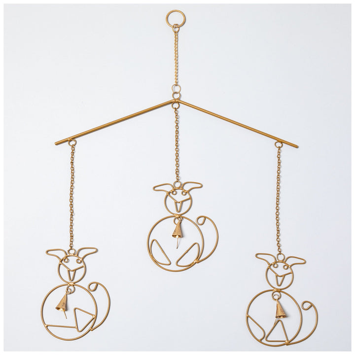 Gold iron wind chime with three animal silhouettes and small hanging bells