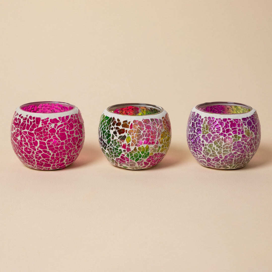 Set of 3 mosaic votive holders, two magenta and one multicolor, round open tops