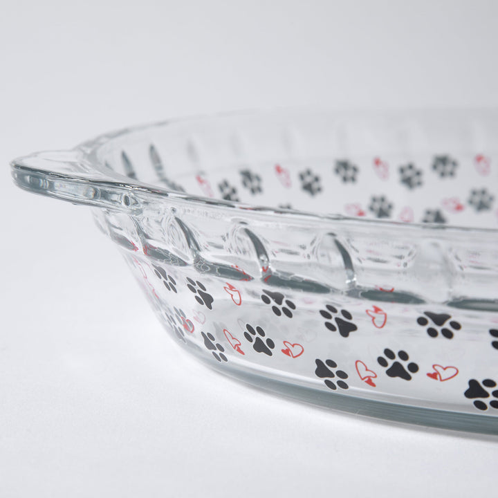Clear glass pie plate with paw-print and heart accents along the rim