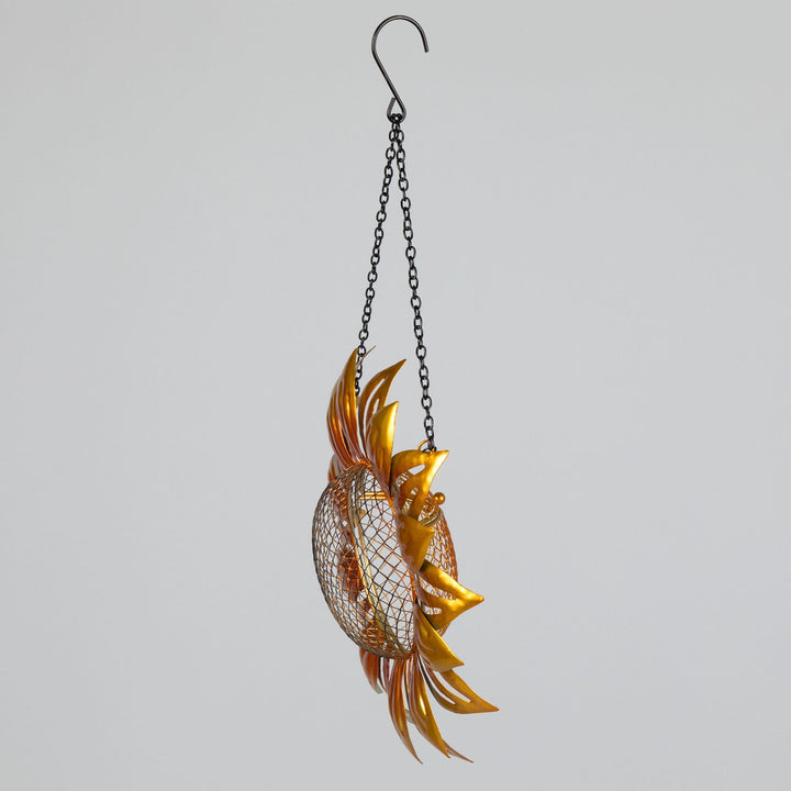Hanging sunflower mesh bird feeder with golden petals and wire mesh seed holder, side view