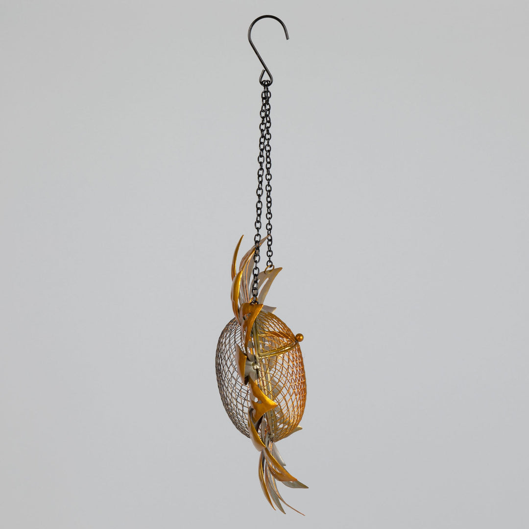 Hanging sunflower mesh bird feeder with golden petals and mesh seed holder, side view