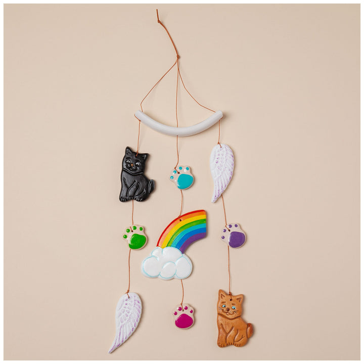 Ceramic pet memorial wind chime with crescent bar, rainbow, cloud, wings, and pet charms