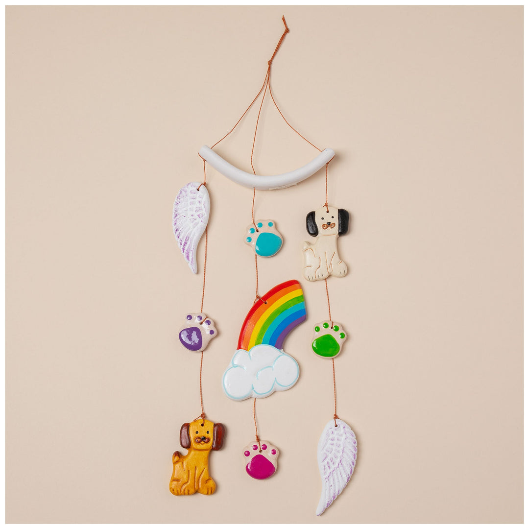 Ceramic pet memorial wind chime with rainbow and cloud center plus wing charms