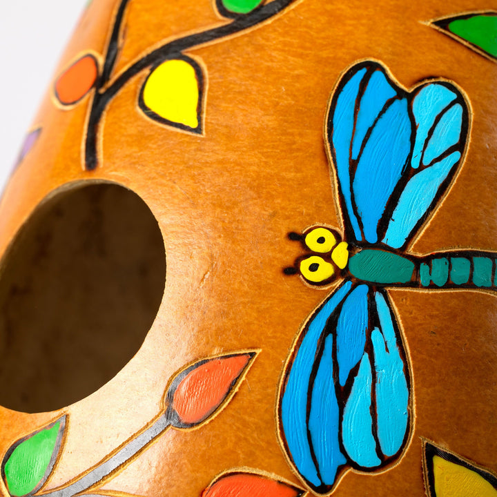 Hand-painted gourd birdhouse close-up with blue butterfly and round entry opening