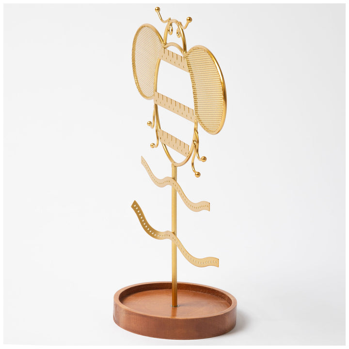 Gold-tone jewelry stand with crown top, mesh discs, and brown round base.
