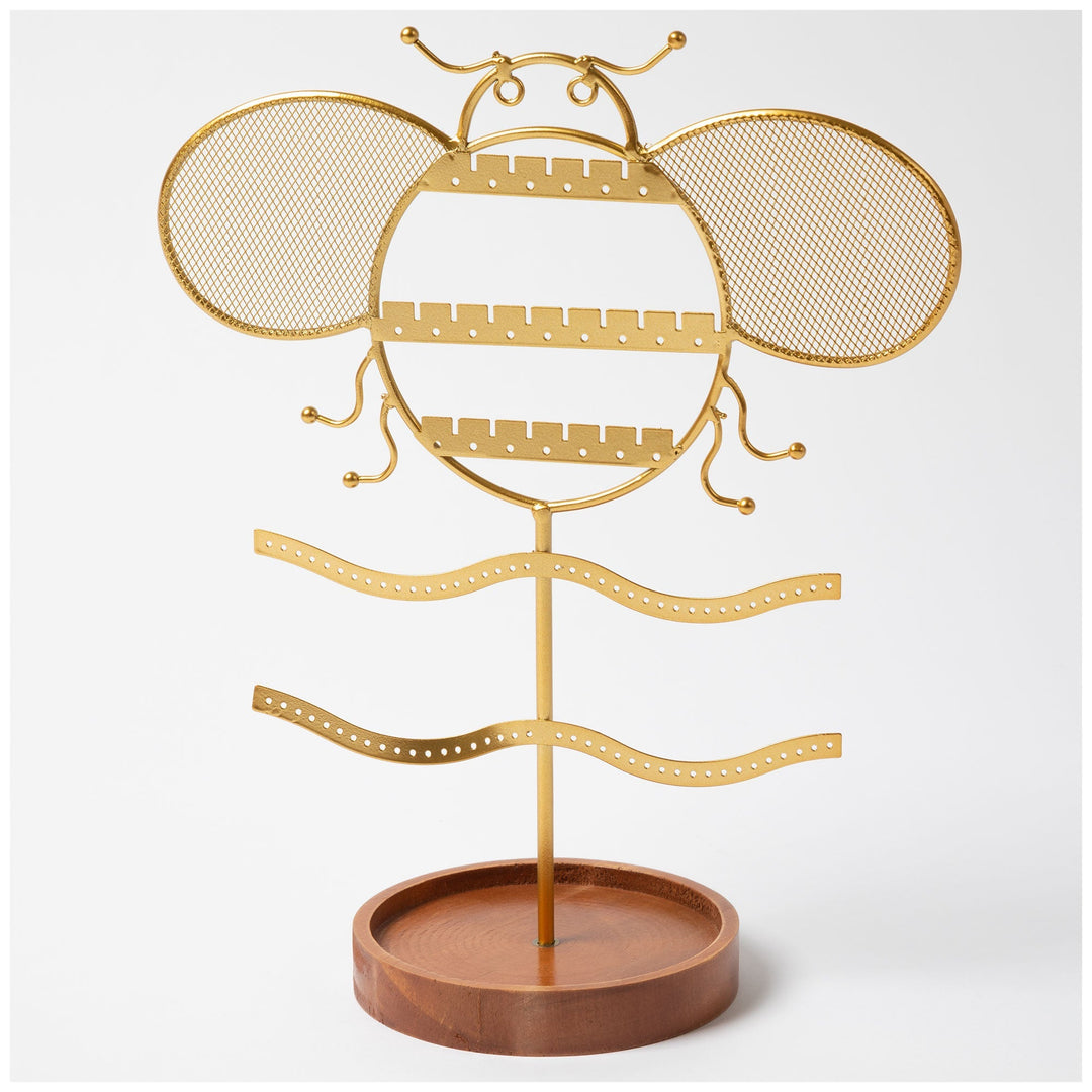 Gold-tone jewelry stand with wide mesh wings and brown round base.