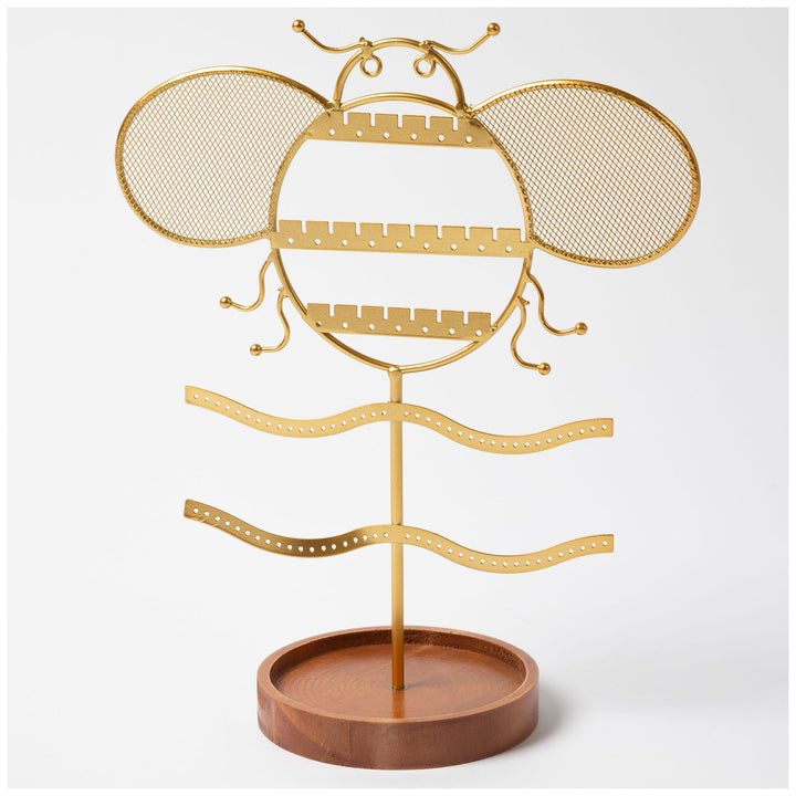 Gold-tone jewelry stand with wide mesh wings and brown round base.