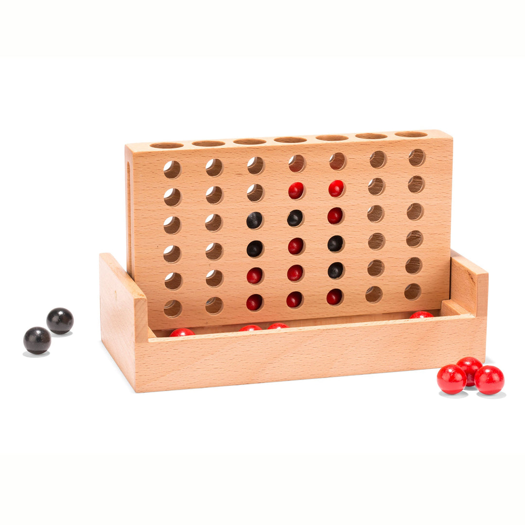 Wooden peg board game with red and black pegs near the front trough