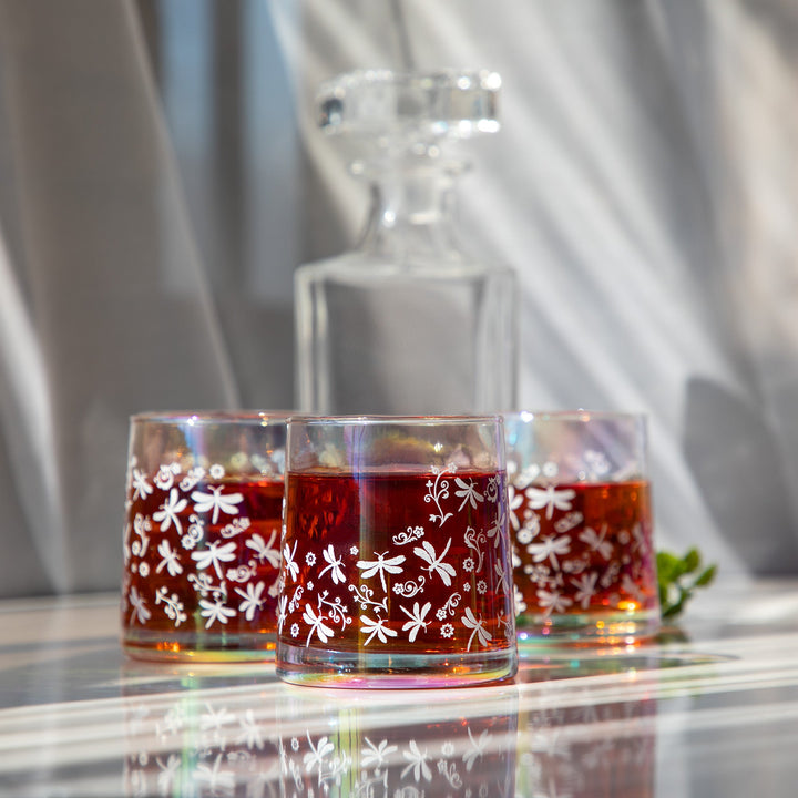Set of 4 iridescent glass candle holders with white snowflake-vine pattern and red wax