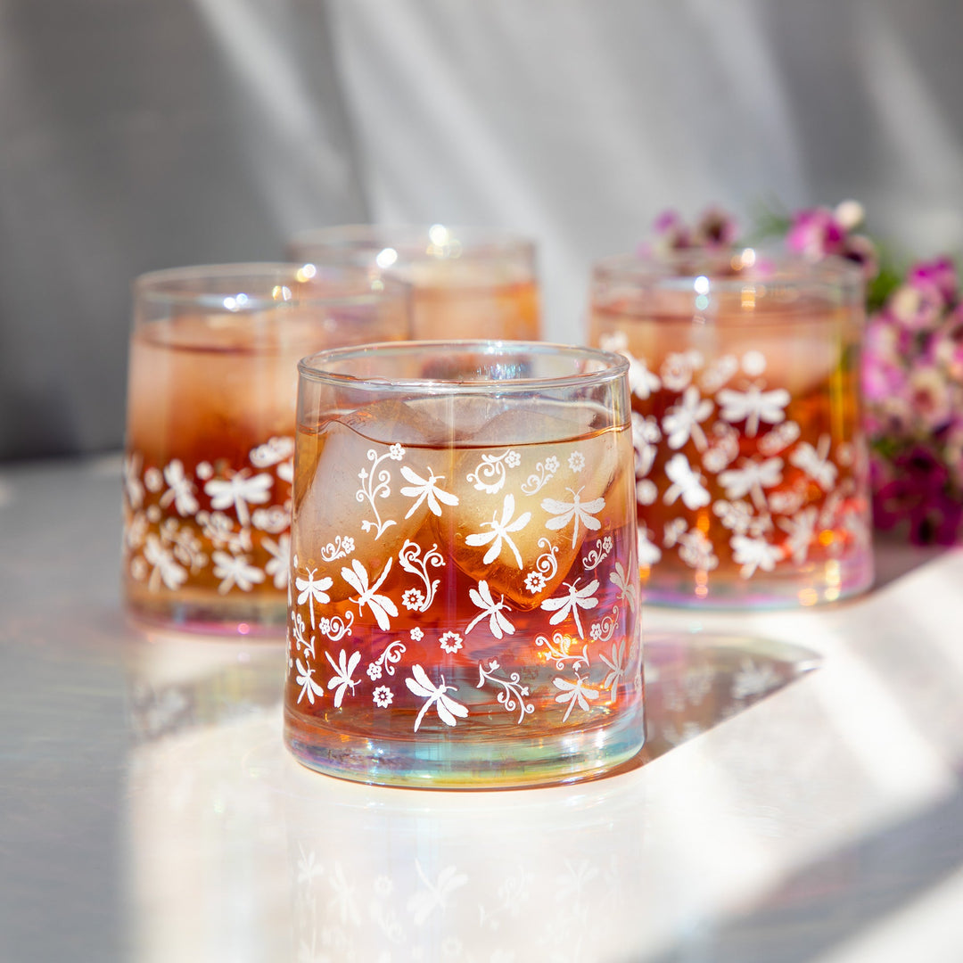 Iridescent glass candle holders with white floral vines and orange wax, set of 4