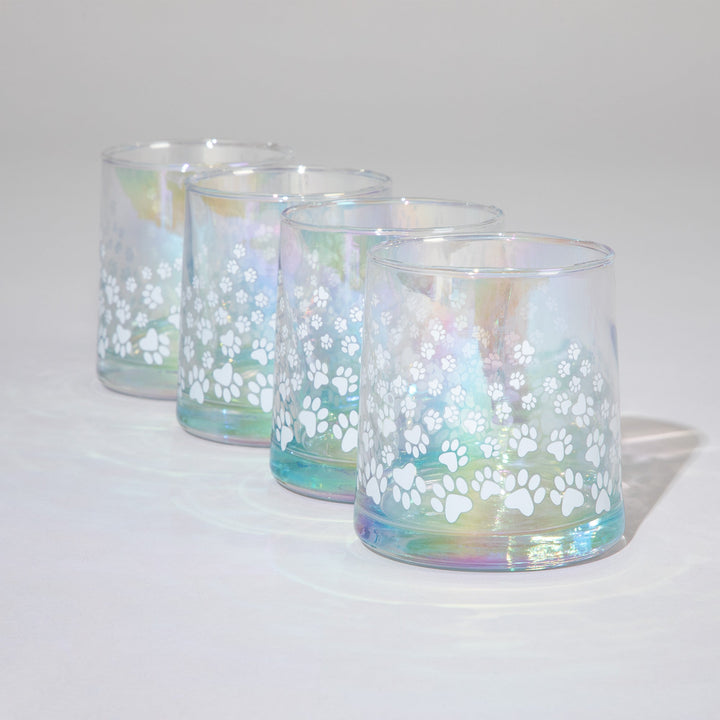 Set of 4 iridescent glass candle holders with white paw-print decals on blue glass