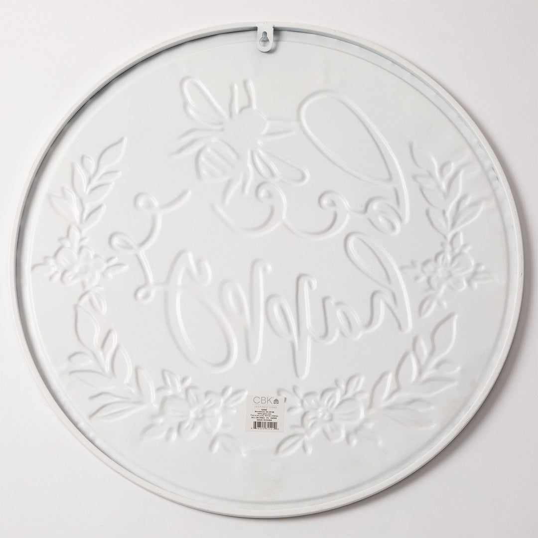 Round wall plaque with white embossed floral vine pattern and hanging loop