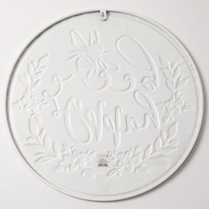 Round wall plaque with white embossed floral vine pattern and hanging loop