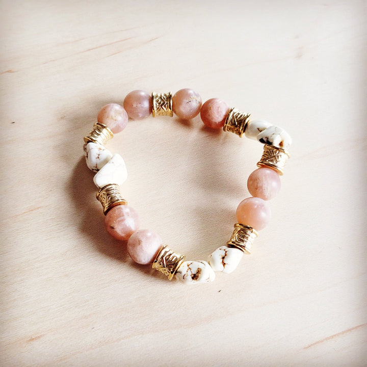 Pink and white stone beaded stretch bracelet with gold-tone barrel spacers
