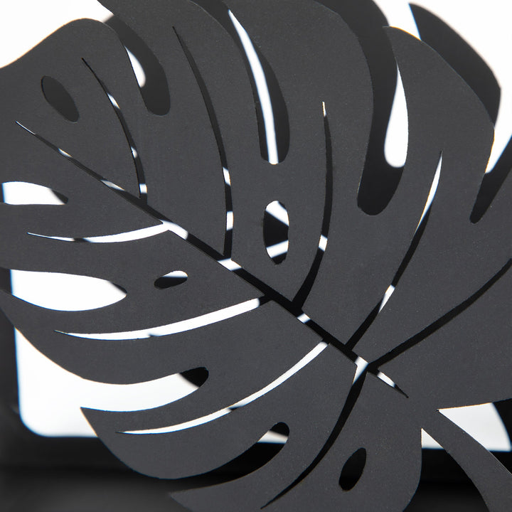 Close-up of black monstera leaf cutout metal napkin holder