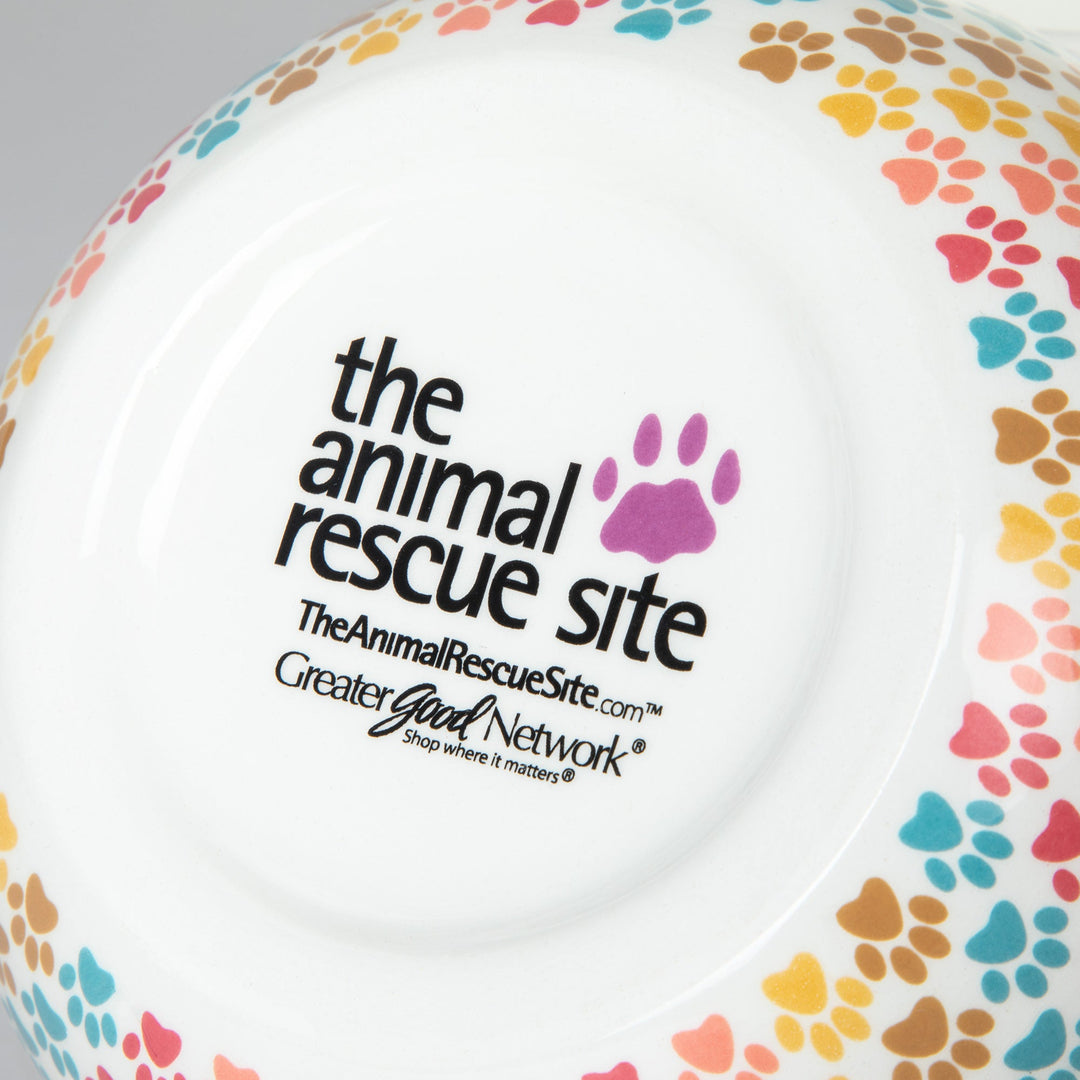 Ceramic bowl interior with multicolor paw-print rim