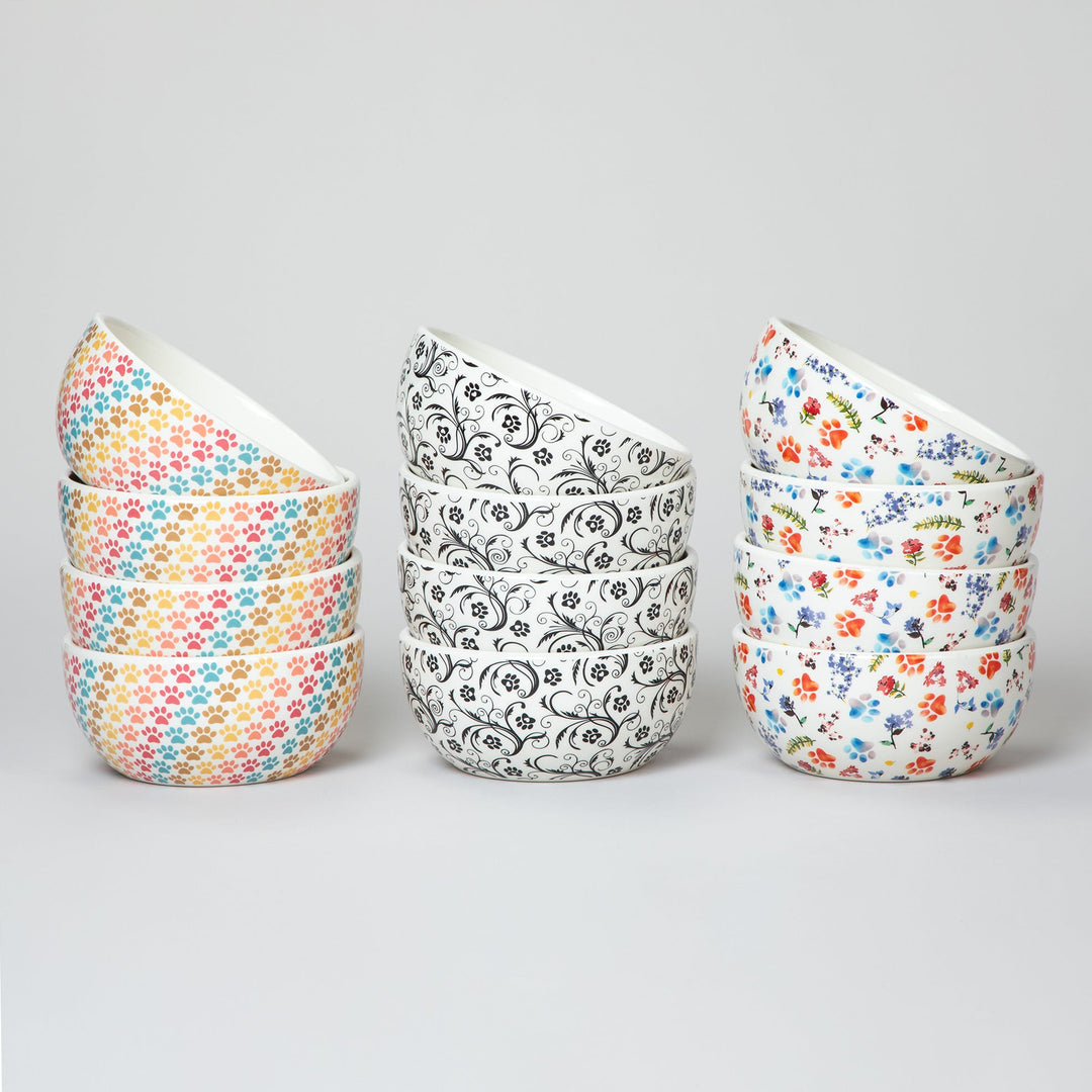 Set of 4 ceramic soup or salad bowls with pastel multicolor paw-print pattern