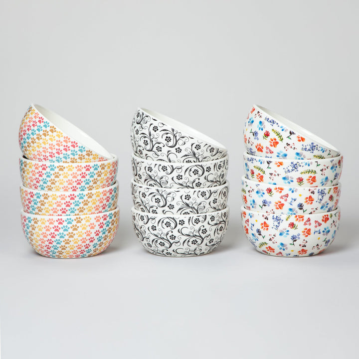 Set of 4 ceramic soup or salad bowls with pastel multicolor paw-print pattern