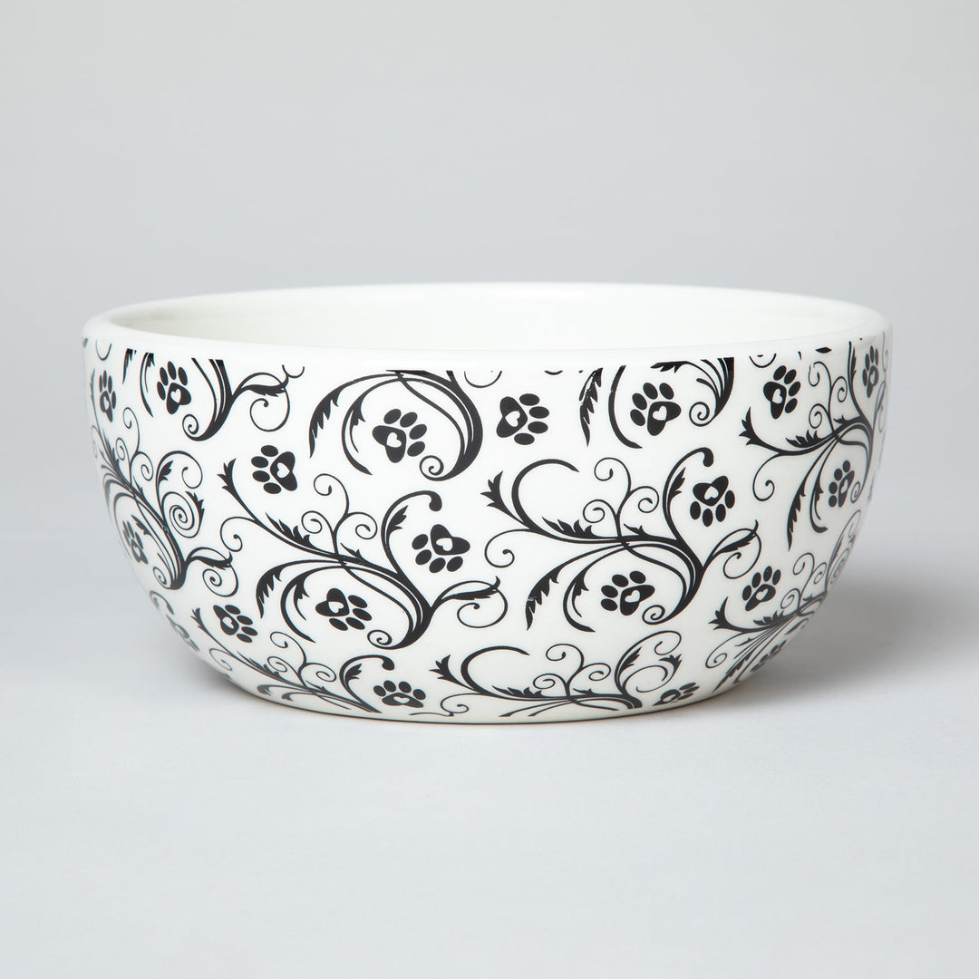 Ceramic soup or salad bowl with black paw-print and swirl design
