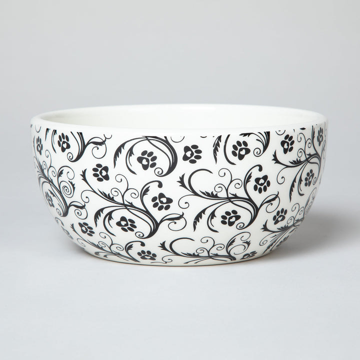Ceramic soup or salad bowl with black paw-print and swirl design