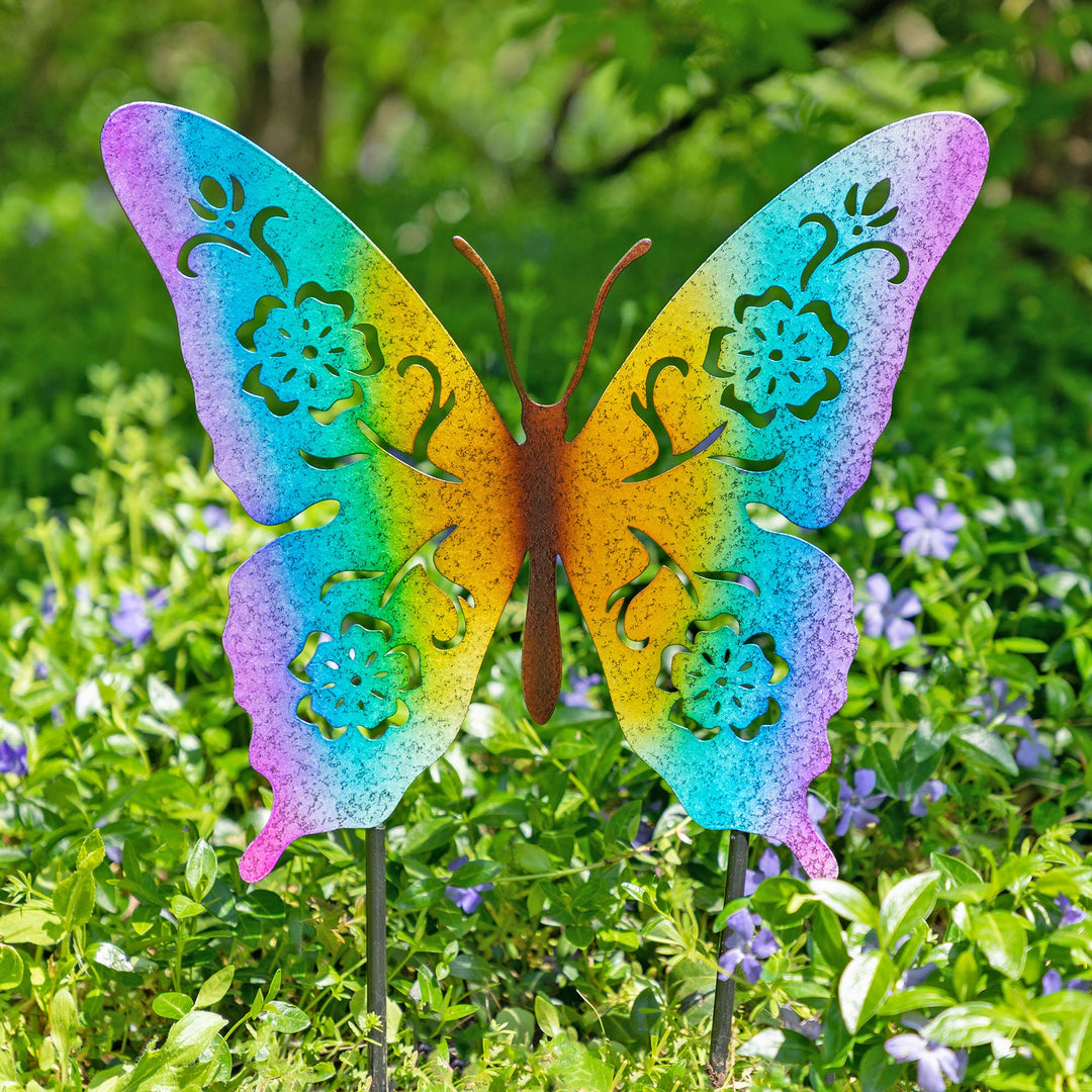 Two butterfly garden silhouette stakes with colorful wings and black metal stems
