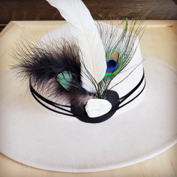 Peacock feather and turquoise leather hat band with curved black trim and white base