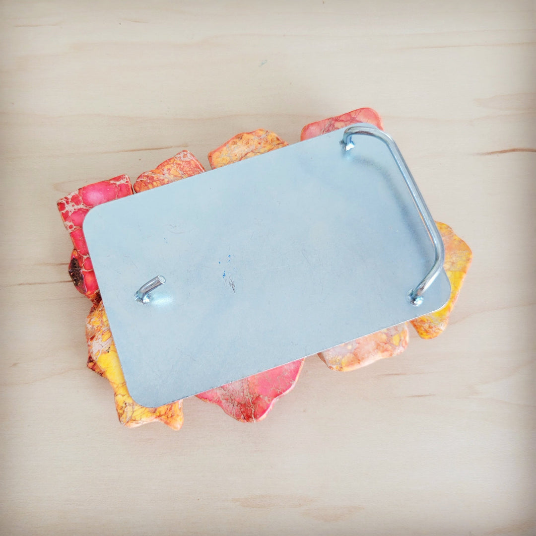 Regalite slab belt buckle backside with blue metal plate and two mounting screws