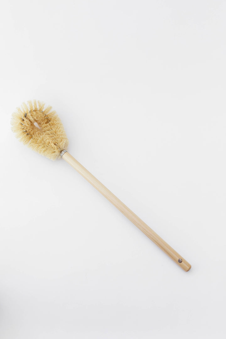 Wood-handled toilet brush with round beige bristle head