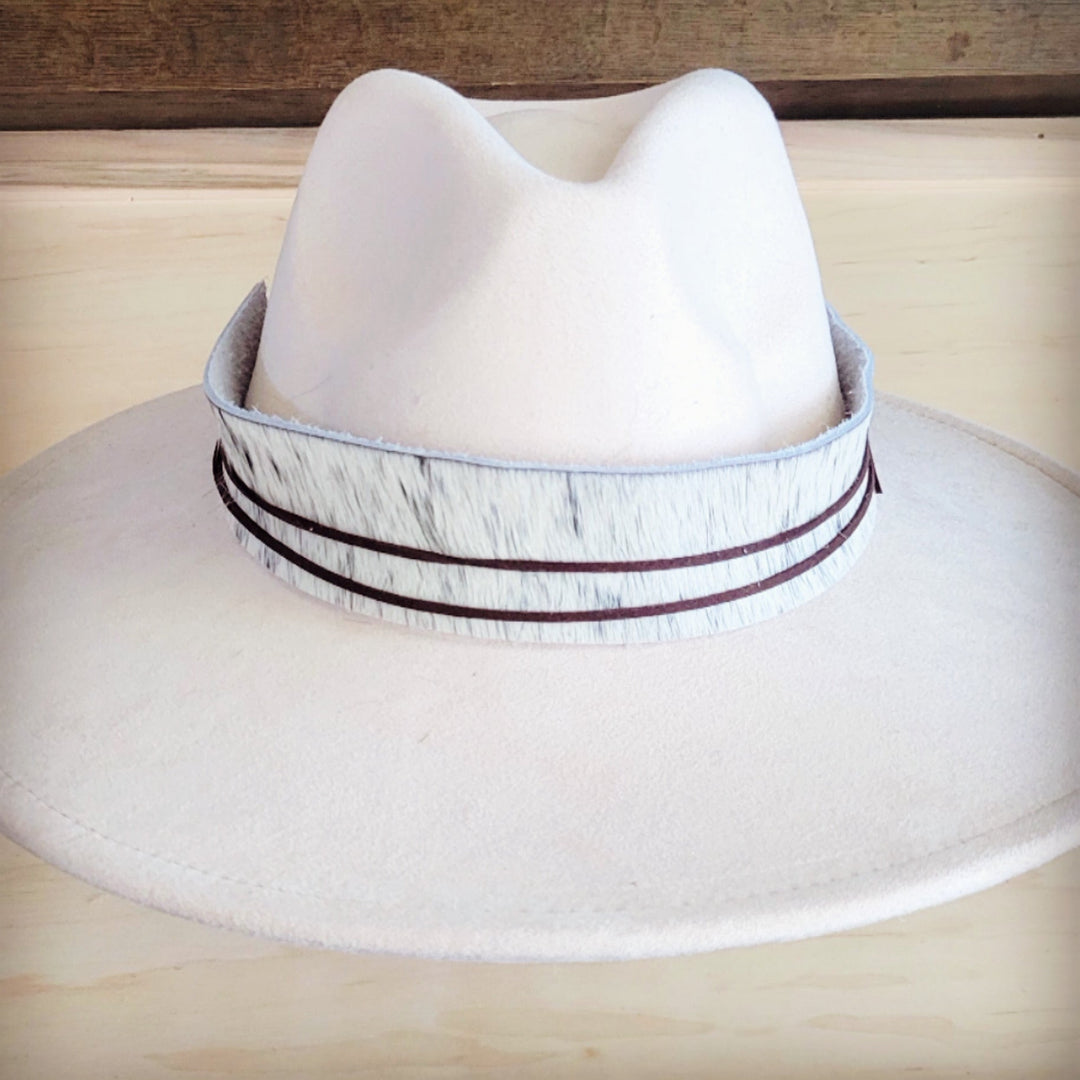 White wide-brim felt hat with gray spotted hair-hide band and dark trim rows